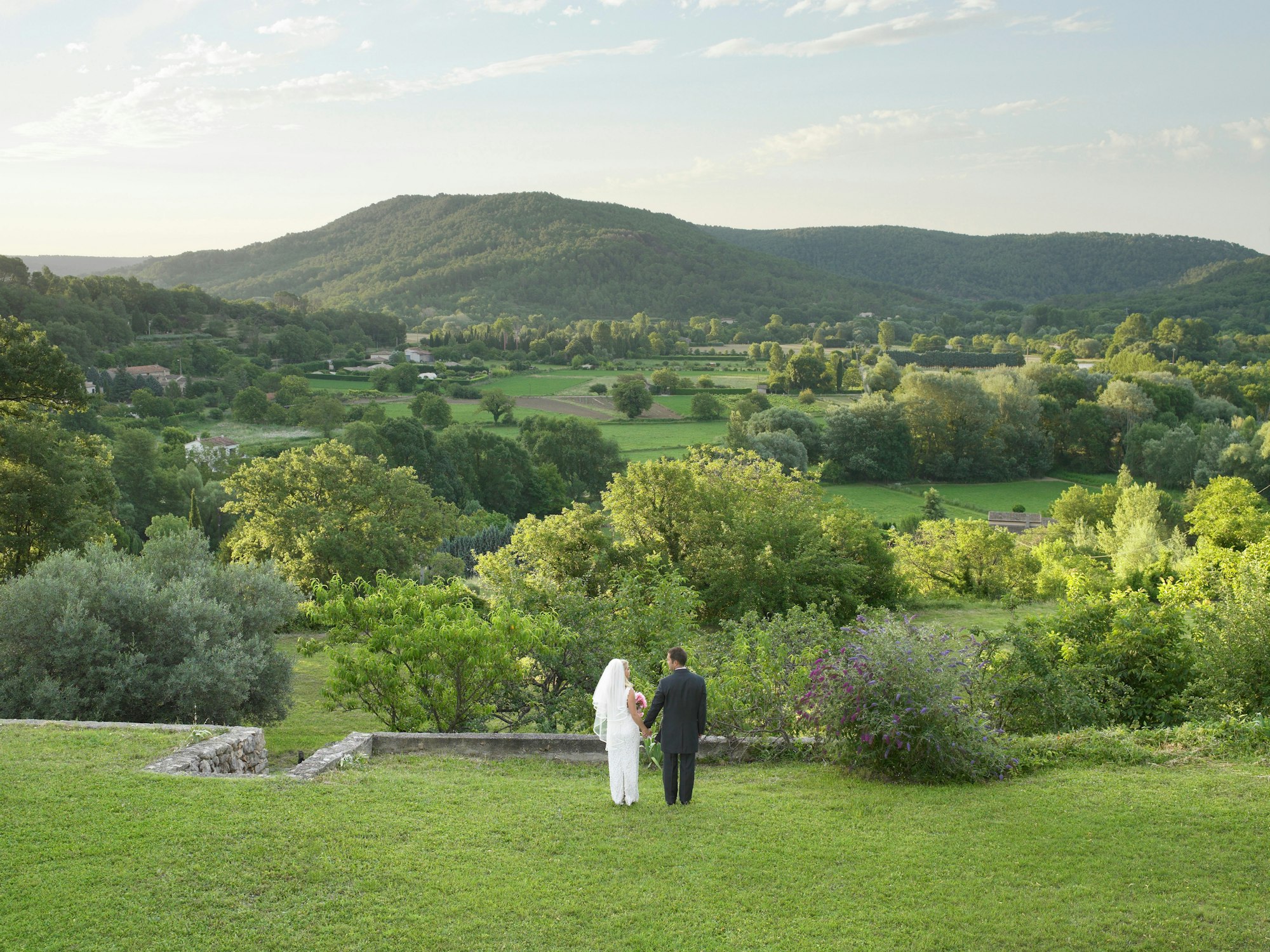 Rear of wedding couple in garden
